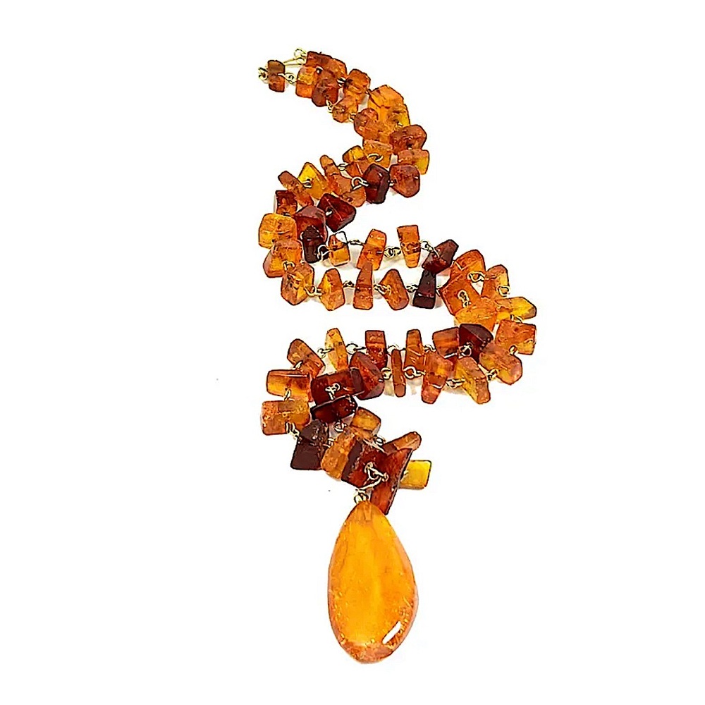 AN ANTIQUE FACETED NATURAL BALTIC AMBER
NECKLACE 26 GRAMS 24"